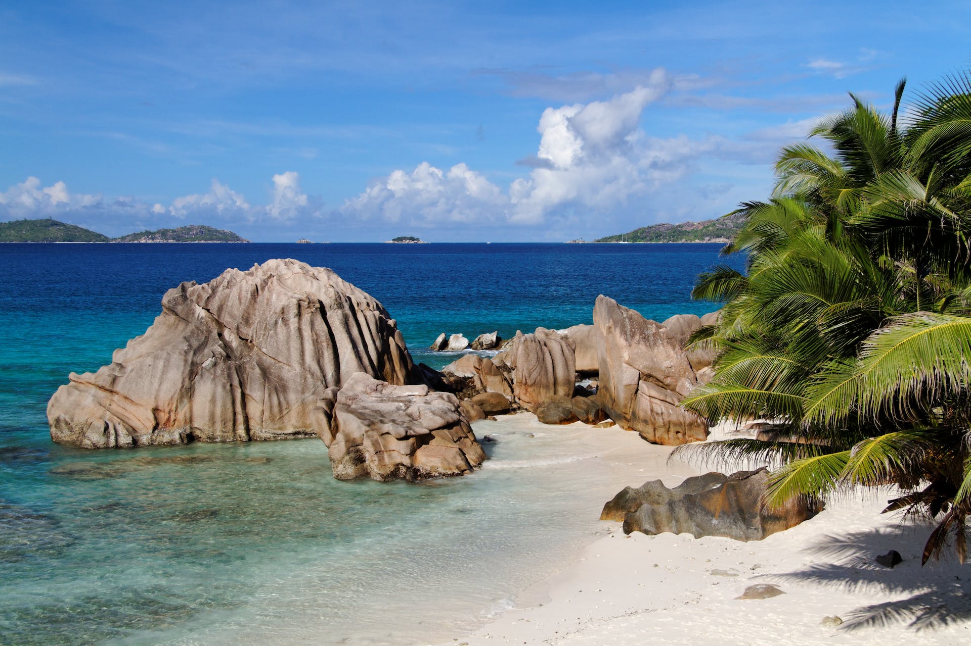 Coastal Majesty: Captivating Brown Rock Formations by the Sea in Seychelles